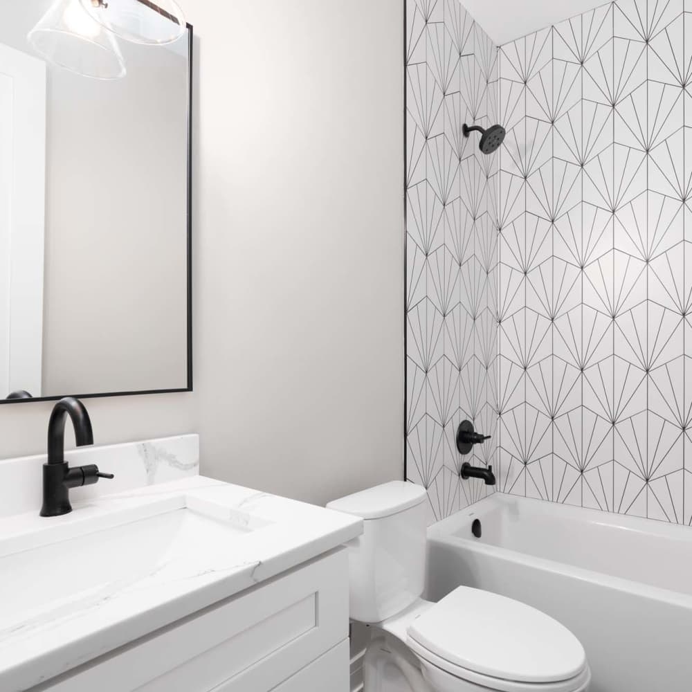 Bright bathroom with sink, commode and bathtub at Coddington Point in Newport, Rhode Island