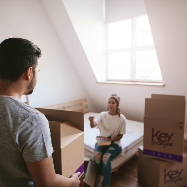 A couple packing boxes near Key Storage in San Antonio, Texas,