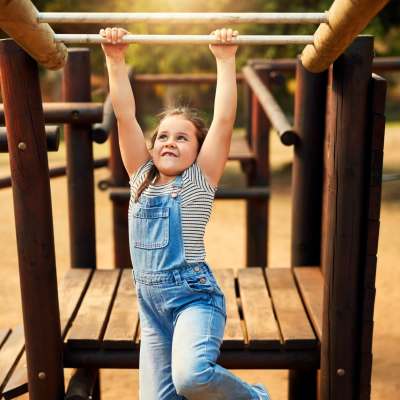 Kid playing on playground at Lakeside Villas in Grand Prairie, Texas