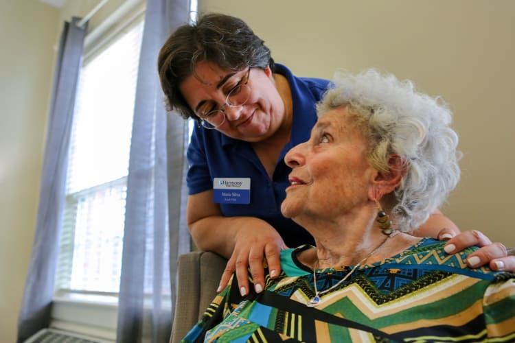 Resident getting help from staff at Harmony at Kent in Dover, Delaware