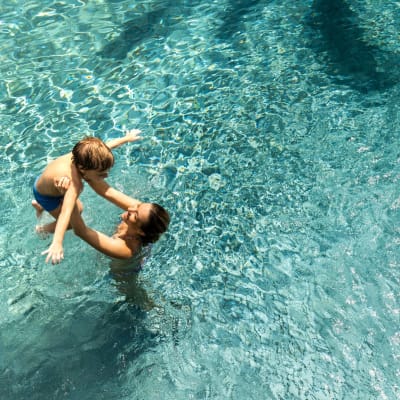 Residents take a swim in the pool at Lofts at Allen Ridge in Abilene, Texas