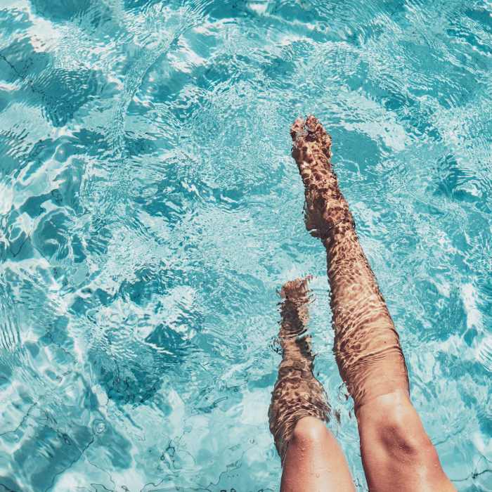 A resident relaxes in the pool at Palmer's Creek, Fredericksburg, Virginia