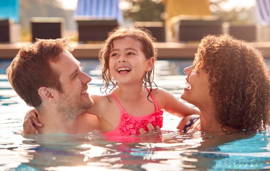 Resident family enjoying in pool at Cypress Point in Mooresville, North Carolina