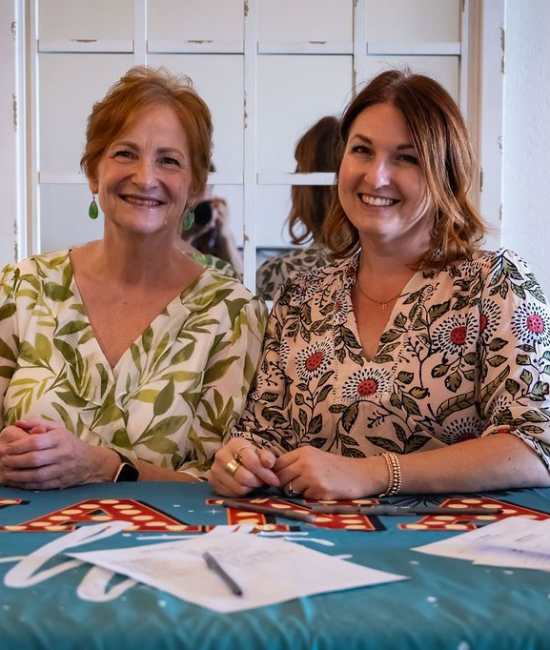 Employees at check-in table at event Ray Stone Inc. 