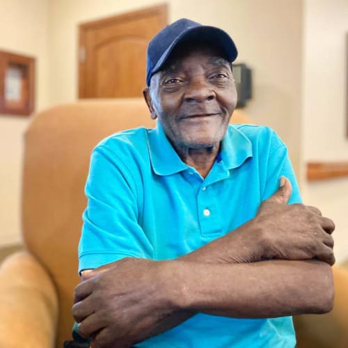 A resident smiling at an Oxford Senior Living location