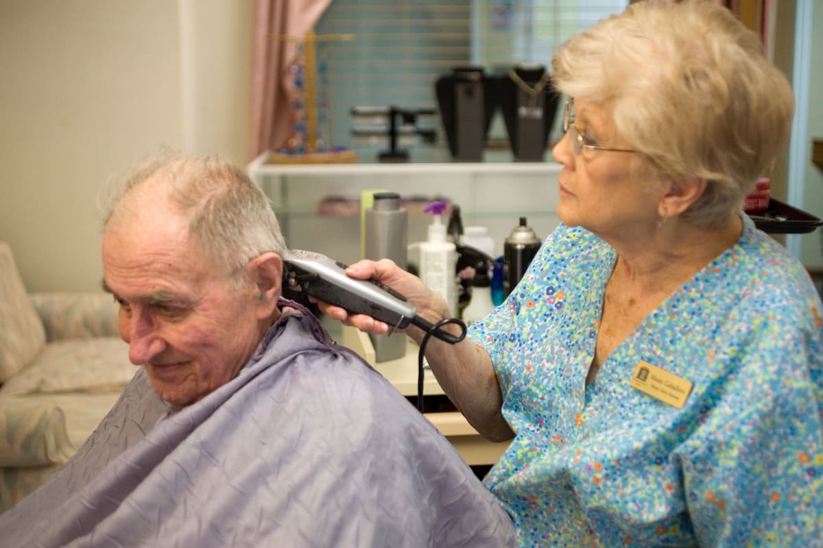 Resident getting a haircut at Parsons House Austin in Austin, Texas