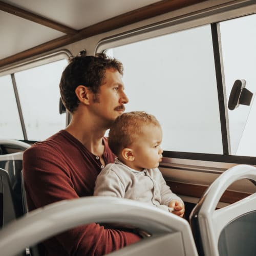 A father and his son riding on a bus near San Onofre II in San Clemente, California