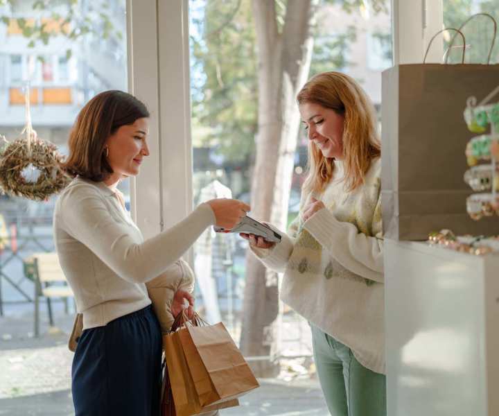 Resident woman making payment in a shop near Fulton Hill Apartments in Tallahassee, Florida