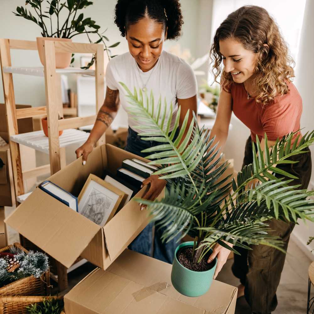 Two residents helping each other at Tesoro Del Valle in Los Angeles, California