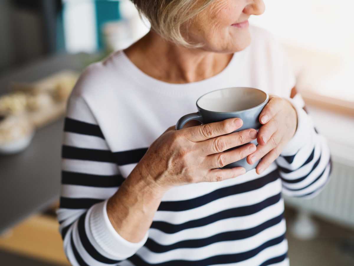 resident drinking coffee  at Mt Bachelor Assisted Living and Memory Care in Bend, Oregon