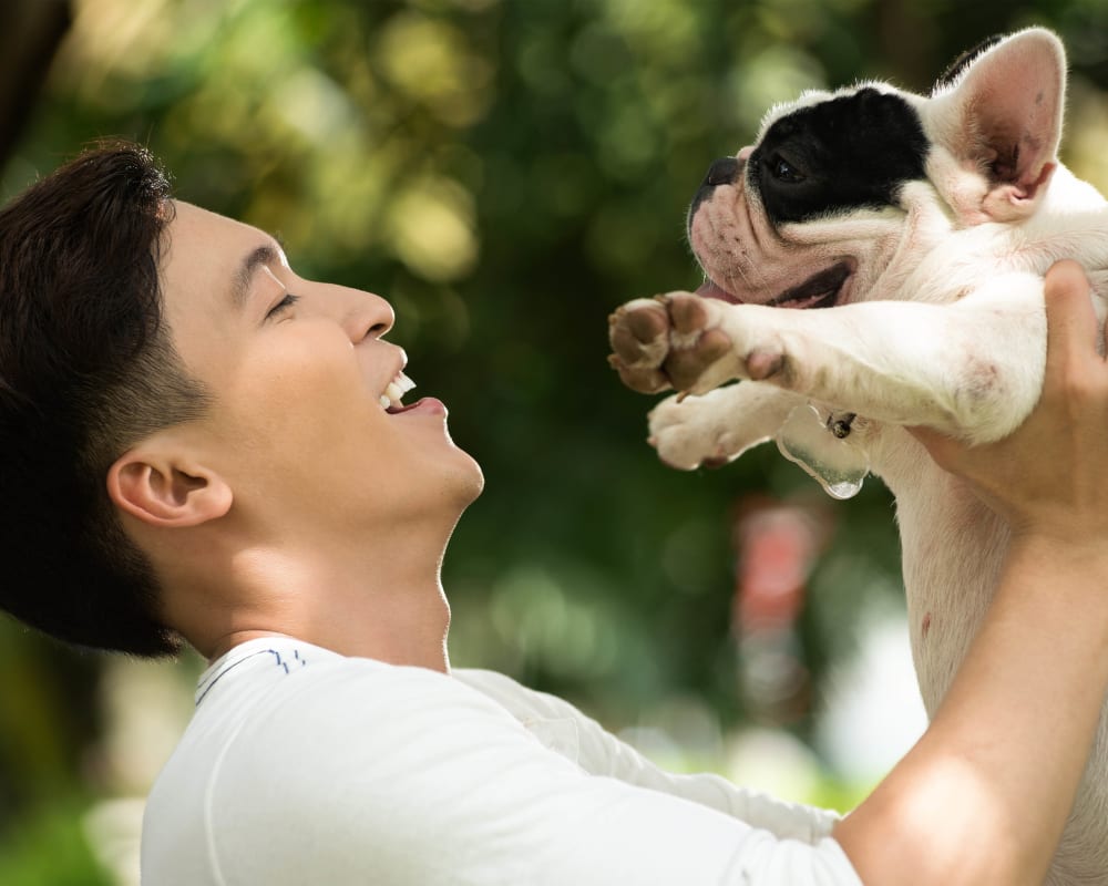 Resident and his dog loving the neighborhood at Olympus Town Center in Keller, Texas