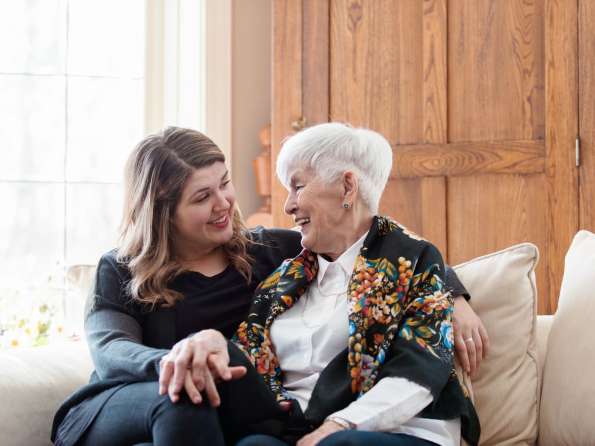 A resident and a staff member chatting at Worthington Manor in Conroe, Texas.