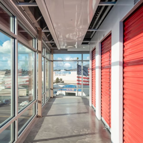 Indoor storage units  with bright red doors at StorQuest Self Storage in Happy Valley, Oregon