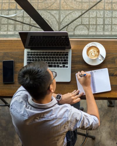 Resident getting some work done from a cafe near Solaire 7077 Woodmont in Bethesda, Maryland