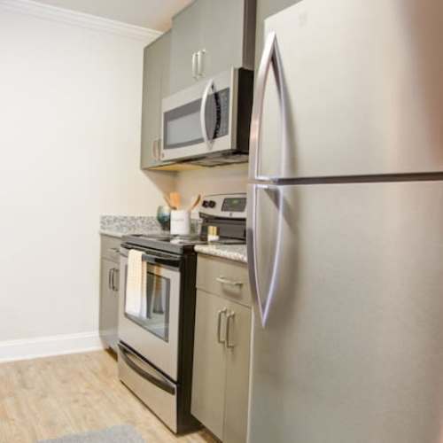 Fully equipped kitchen with stainless steel appliances like a refrigerator at Laurel View in Concord, North Carolina