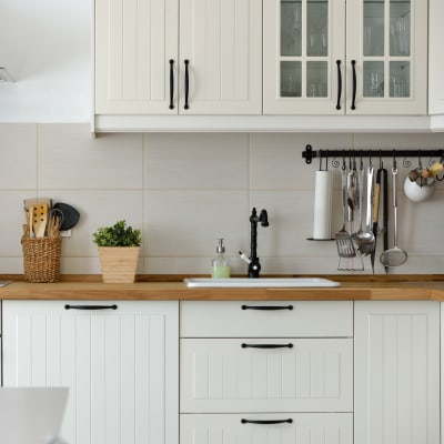 White cabinets in a kitchen at South Mesa I in Oceanside, California