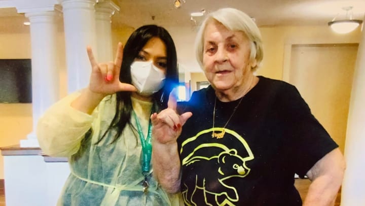 VIVA! Life Coordinator shares sign language messages with resident 