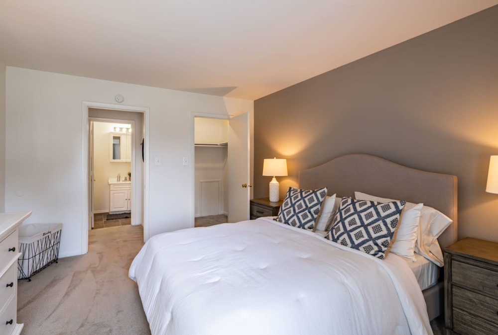 Bedroom with ensuite bathroom and walk-in closet at Country Village Apartment Homes in Dover, Delaware