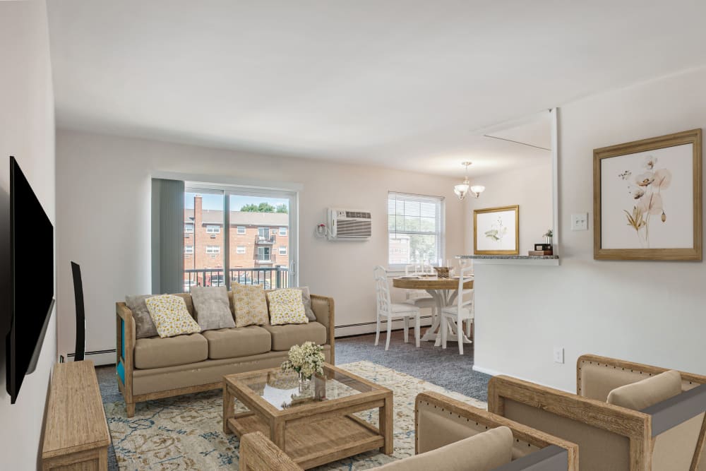 Spacious living room in a model home at Hill Brook Place Apartments in Bensalem, Pennsylvania