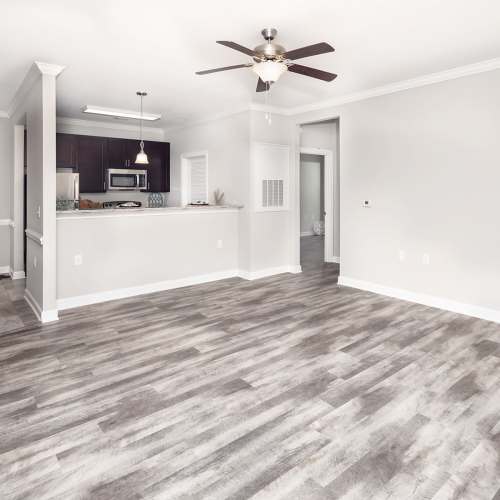 Unfurnished spacious living room with ceiling fan at Mills Creek in Gastonia, North Carolina