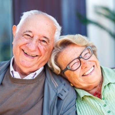 Resident couple sitting outside at York Gardens in Edina, Minnesota