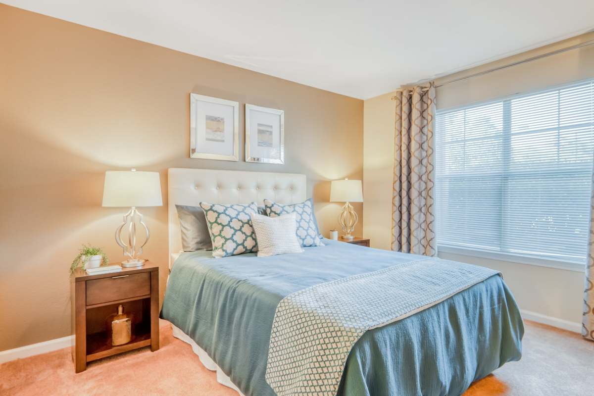 Bedroom with ample natural light at Legacy Mill in Athens, Georgia