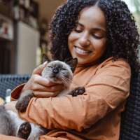 Resident and her cat at Vivo Living Charlotte in Charlotte, North Carolina