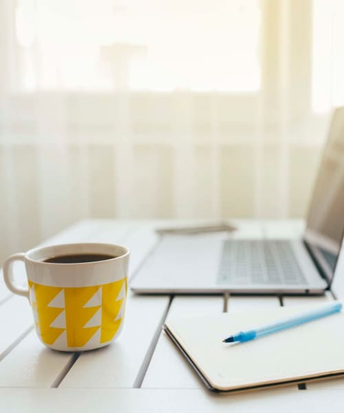 Laptop and cup of coffee at Somerset Court in Baltimore, Maryland