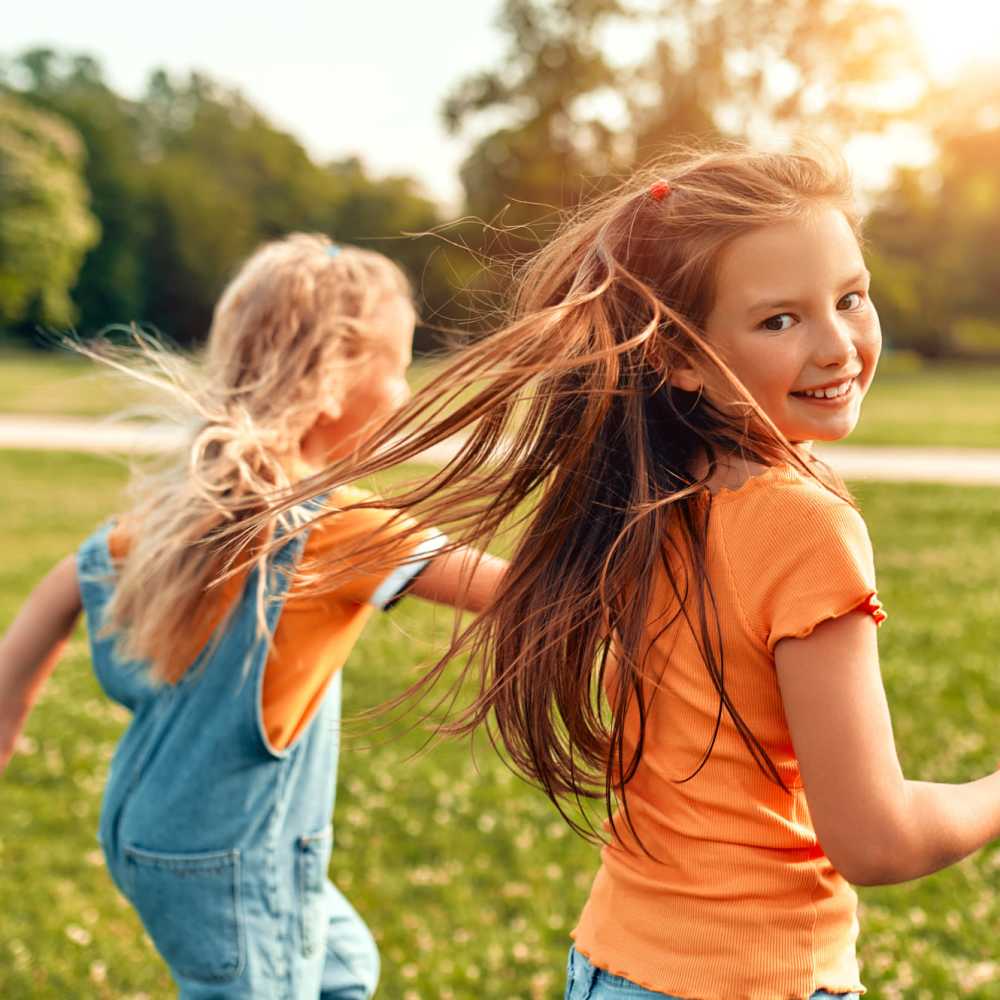 Kids running in a park near Alamar at Fernwood Forest in Indiantown, Florida