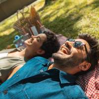 Residents relaxing outdoors near River Club in Holland, Michigan