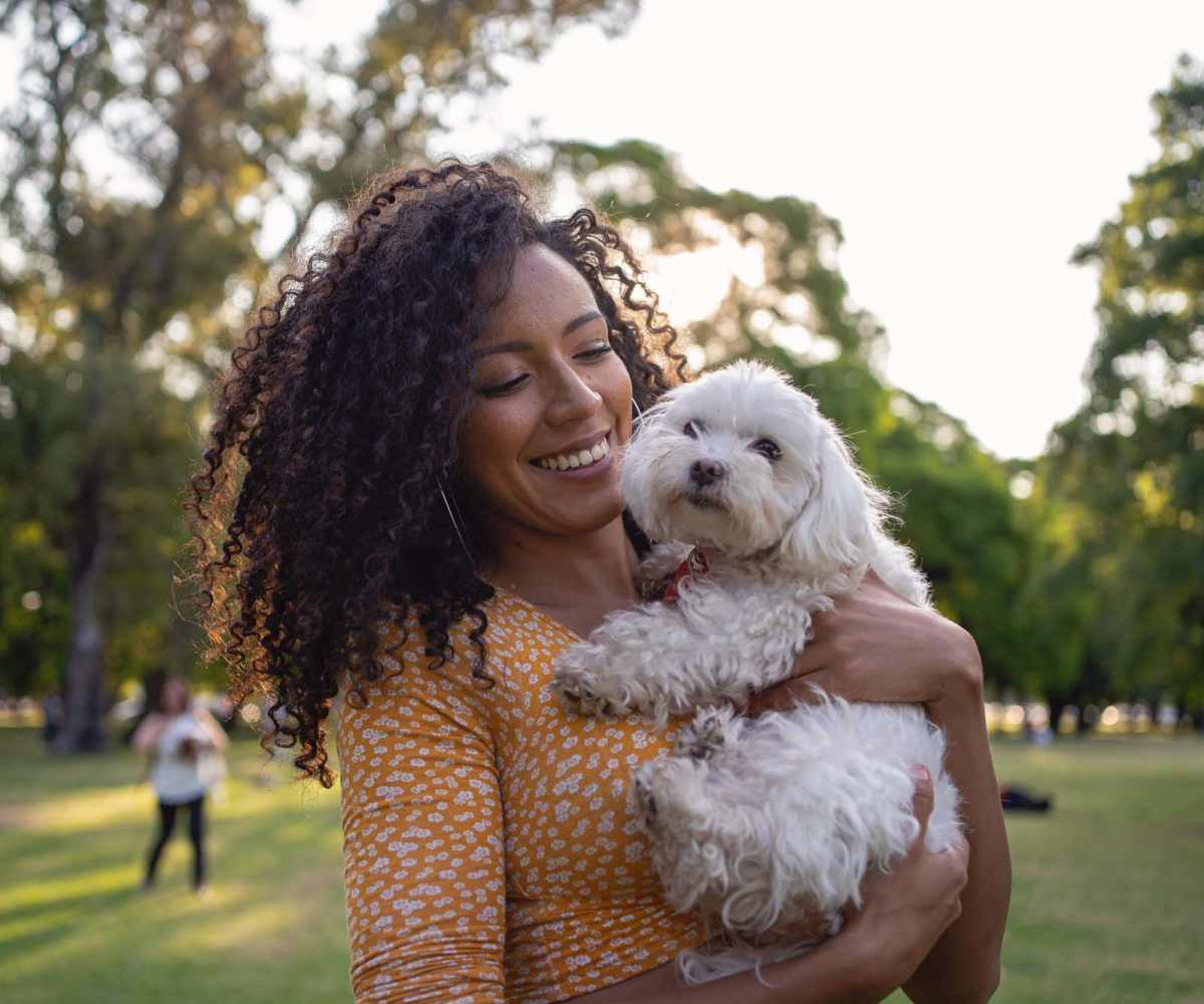 Resident woman with her dog in a park at Meribel in Weaverville, North Carolina