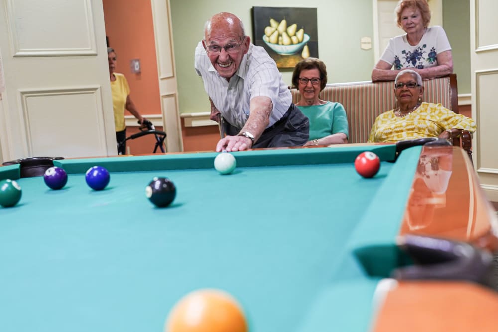 Residents playing pool Harmony at White Oaks in Bridgeport, West Virginia