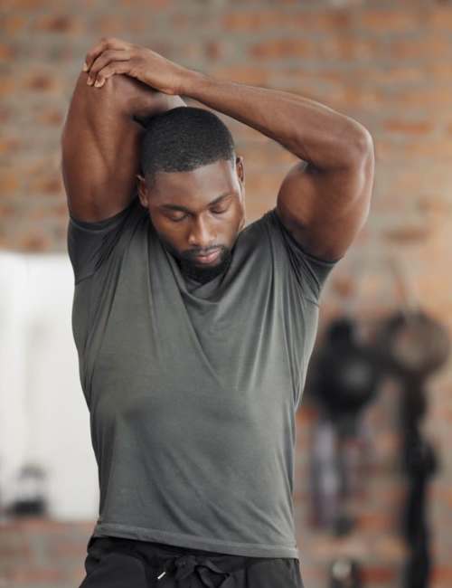 A resident working out in the community fitness center at Pinnacle at Afton in Richmond, Virginia 