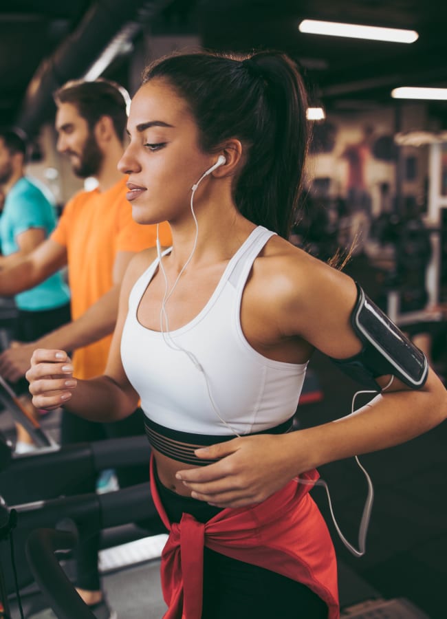 Women running on the treadmill at Cortland Village Apartment Homes in Hillsboro, Oregon