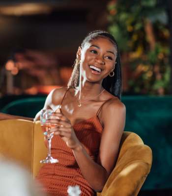 Resident enjoying drinks at nearby lounge at The Carlton At Lake Dexter in Winter Haven, Florida
