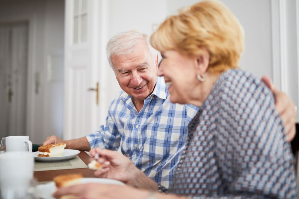 A senior couple enjoying coffee at Vista Prairie at Goldfinch Estates in Fairmont, Minnesota