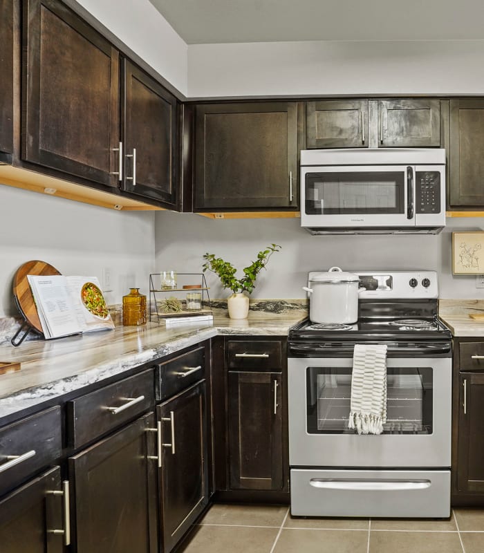 Kitchen with granite countertops at Park at Coulter in Amarillo, Texas