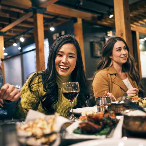 Residents having dinner near Villas At Camino Bernardo in San Diego, California