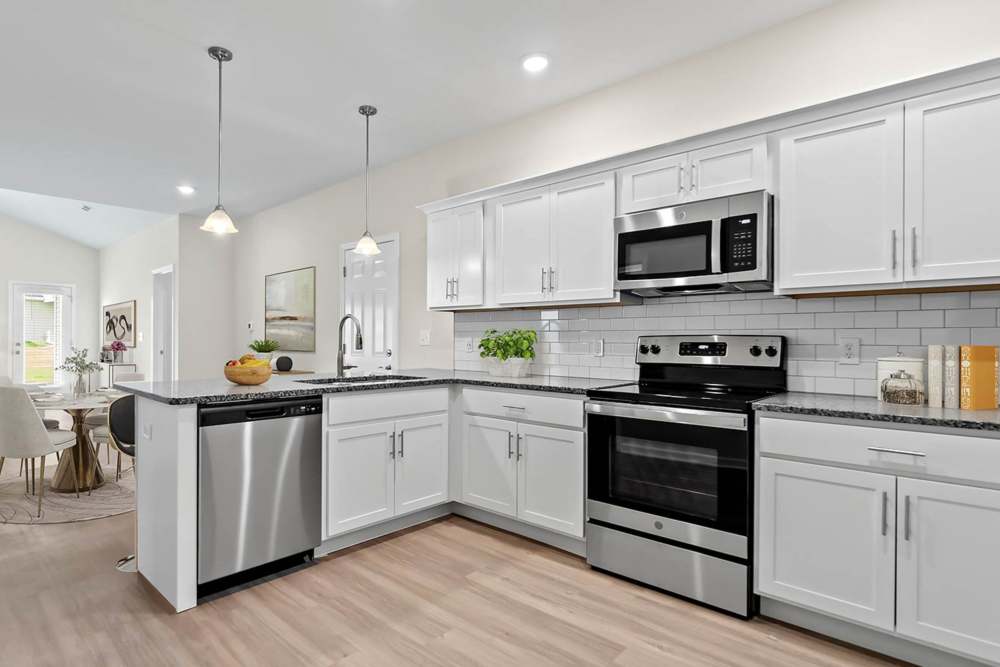 Kitchen with cool details at Crystal Lake & Kingsley Apartments and Townhomes in Fayetteville, North Carolina