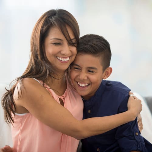 A mother hugging her son at Ben Moreell in Norfolk, Virginia