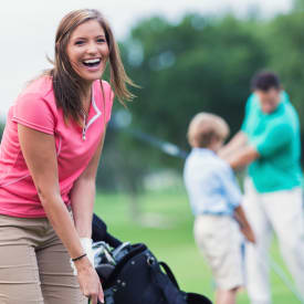 A woman playing golf near Hunt Club Apartments in Cockeysville, Maryland