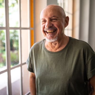 Man smiling at RockBrook Memory Care in Lewisville, Texas