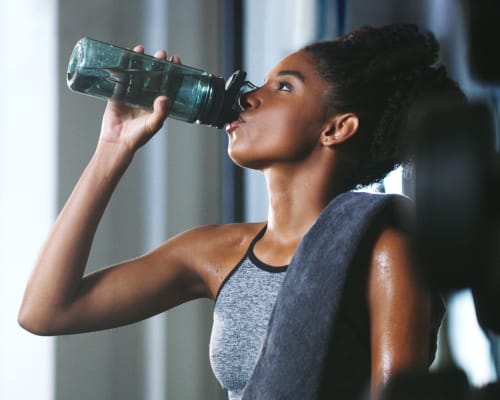 Resident drinking water after a hard workout at Highland Grove in Richmond, Virginia