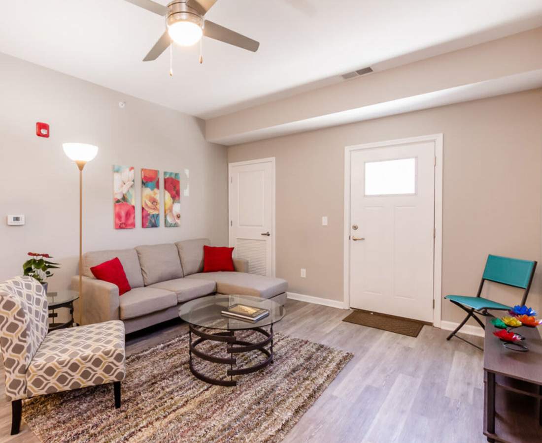 Bright living space with seating and wall art at Eagle Ridge Circle in Rochester, New York