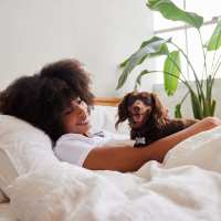 Resident with her dog at Stadium West Apartments in Arlington, Texas