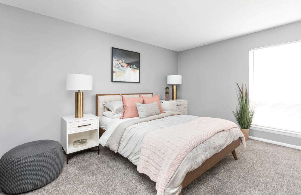 Bedroom with wall to wall carpeting at Astoria Park Apartment Homes in Indianapolis, Indiana