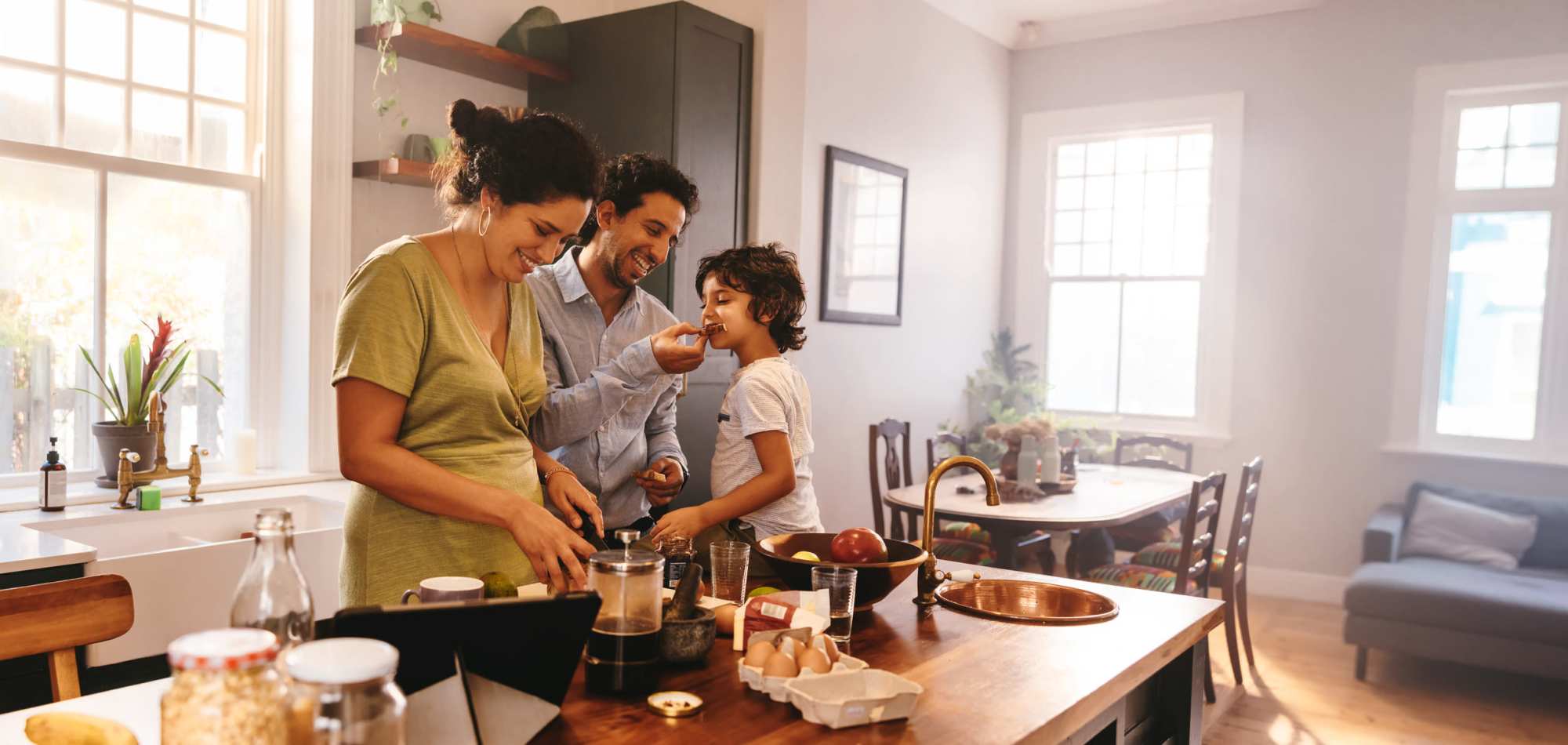 A family prepares a meal in their kitchen at Commons on Potomac Square, Sterling, Virginia