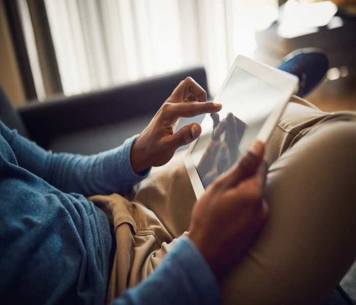 resident working on a tablet at Avion Apartments in Jacksonville, Florida 