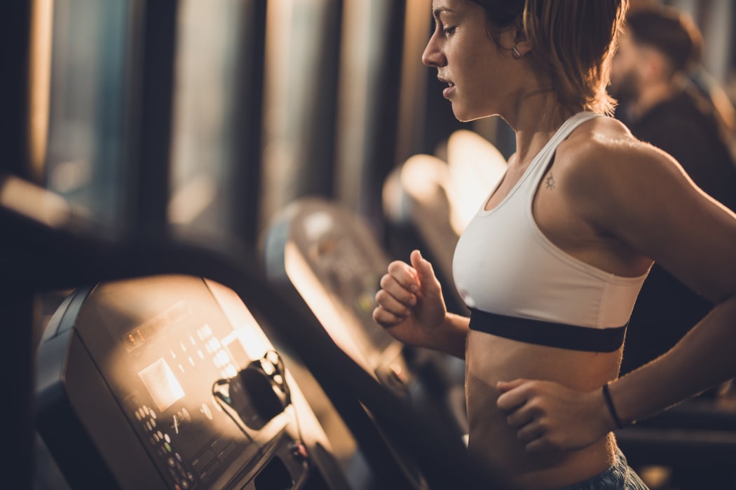 Woman running on a treadmill at Stonehorse Crossing Apartments in Oklahoma City, Oklahoma