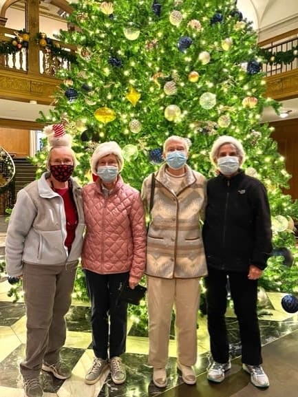 Ballard (WA) residents pose for a photo in front of the Christmas tree.